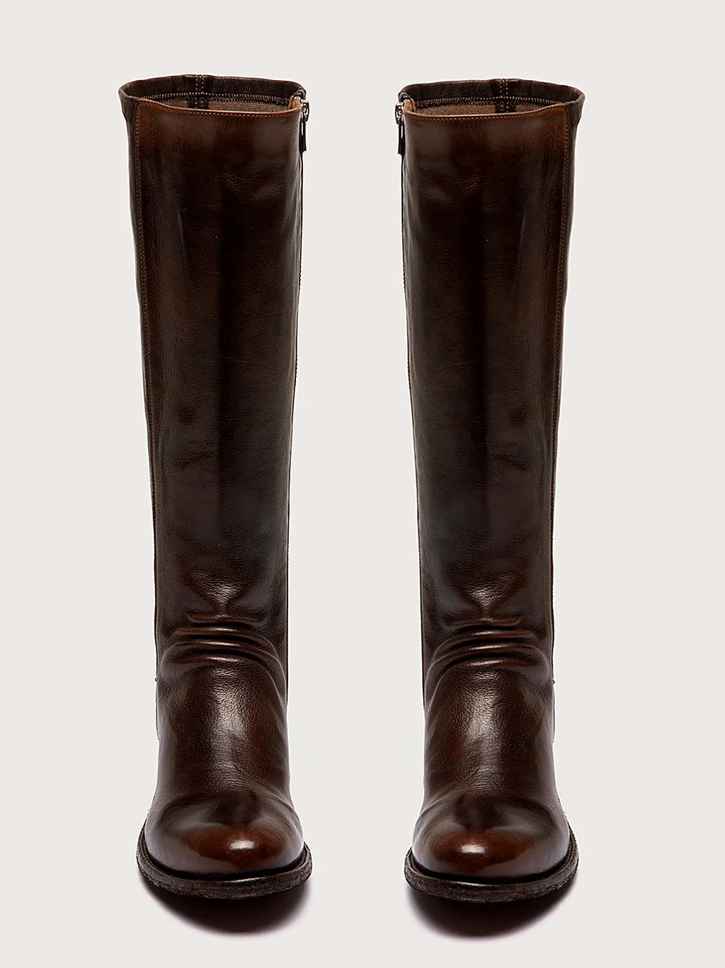 Brown stretch back pair arranged together on a neutral ground