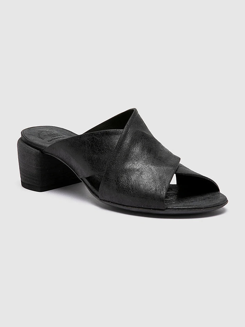 Black slides italian-made pair arranged together on a neutral ground