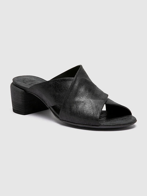 Black slides italian-made pair arranged together on a neutral ground