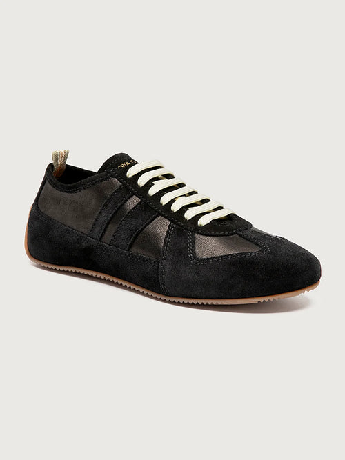Black sneakers white-laced front view showing the shape of the toe