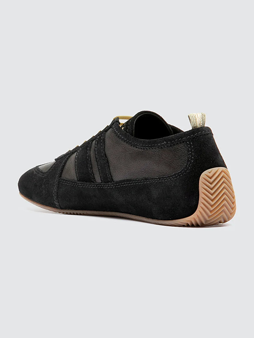Black sneakers white-laced detail of the stitching and upper