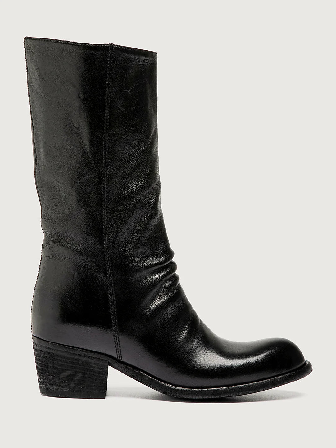 Black stacked heel seen at an angle showing the toe