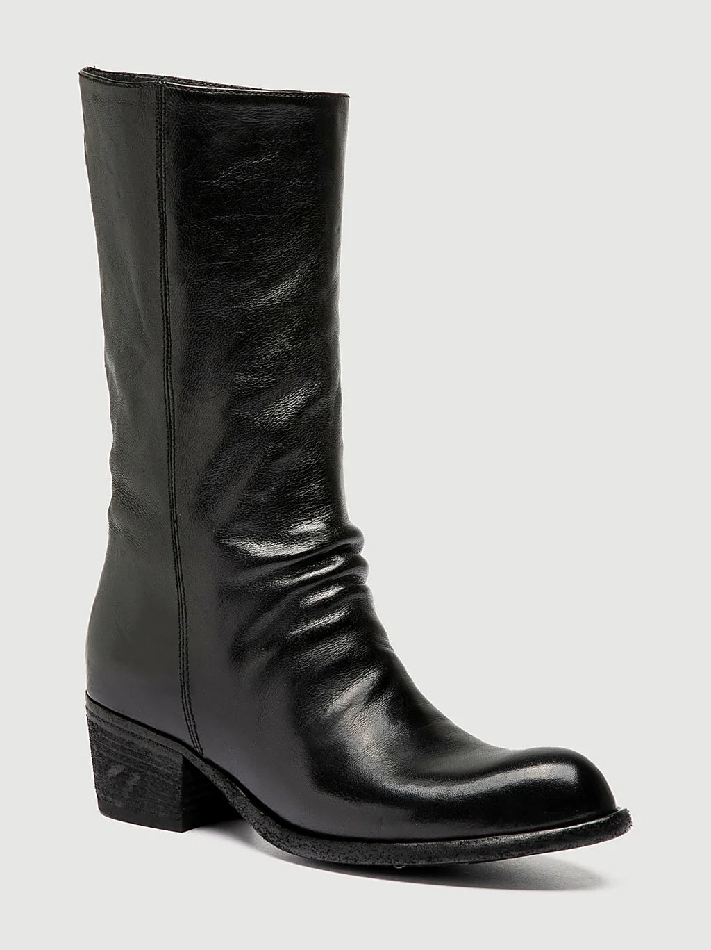 Black stacked heel close view of the heel and sole edge
