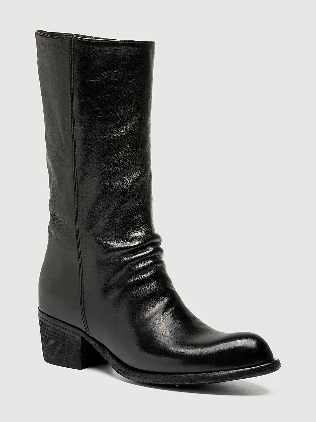 Black stacked heel close view of the heel and sole edge