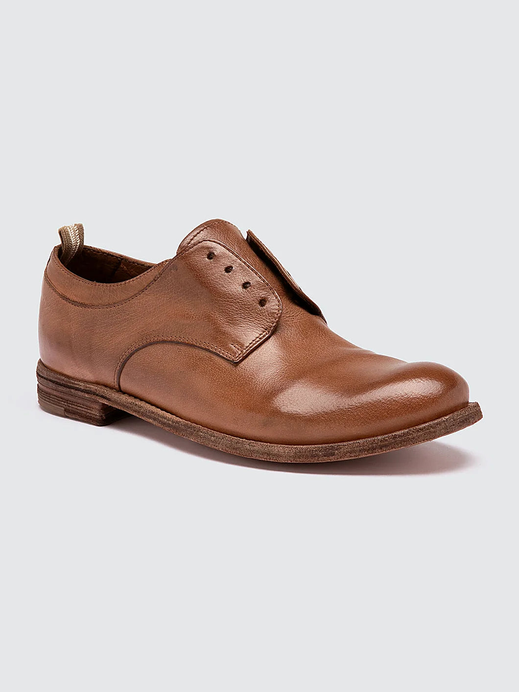 Brown derby lace-ups close view of the heel and sole edge