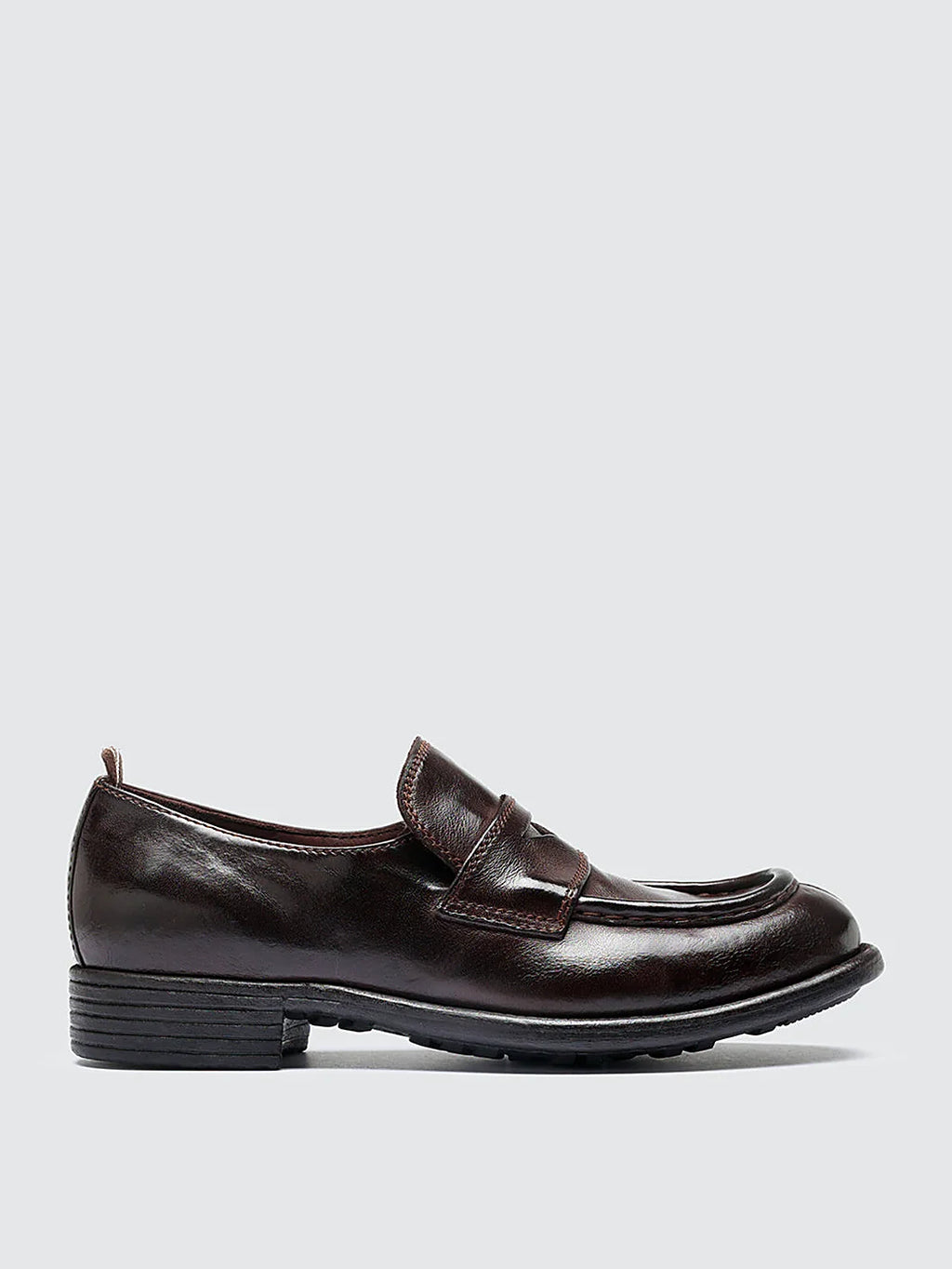 Burgundy rubber sole pair arranged together on a neutral ground