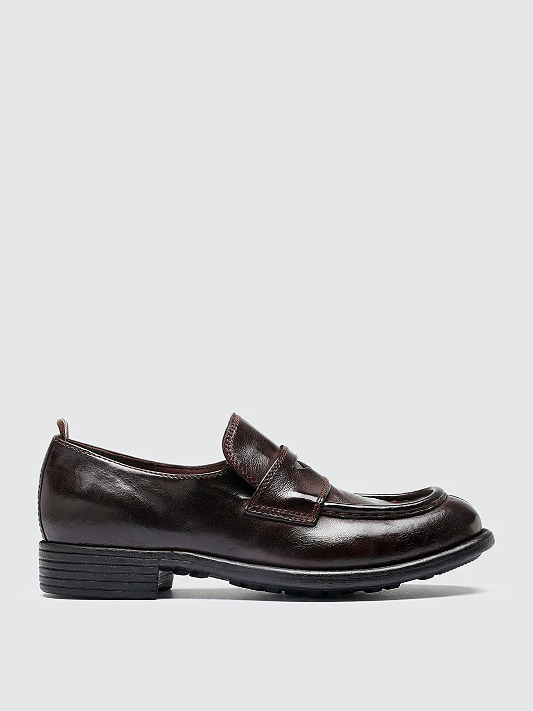 Burgundy rubber sole pair arranged together on a neutral ground