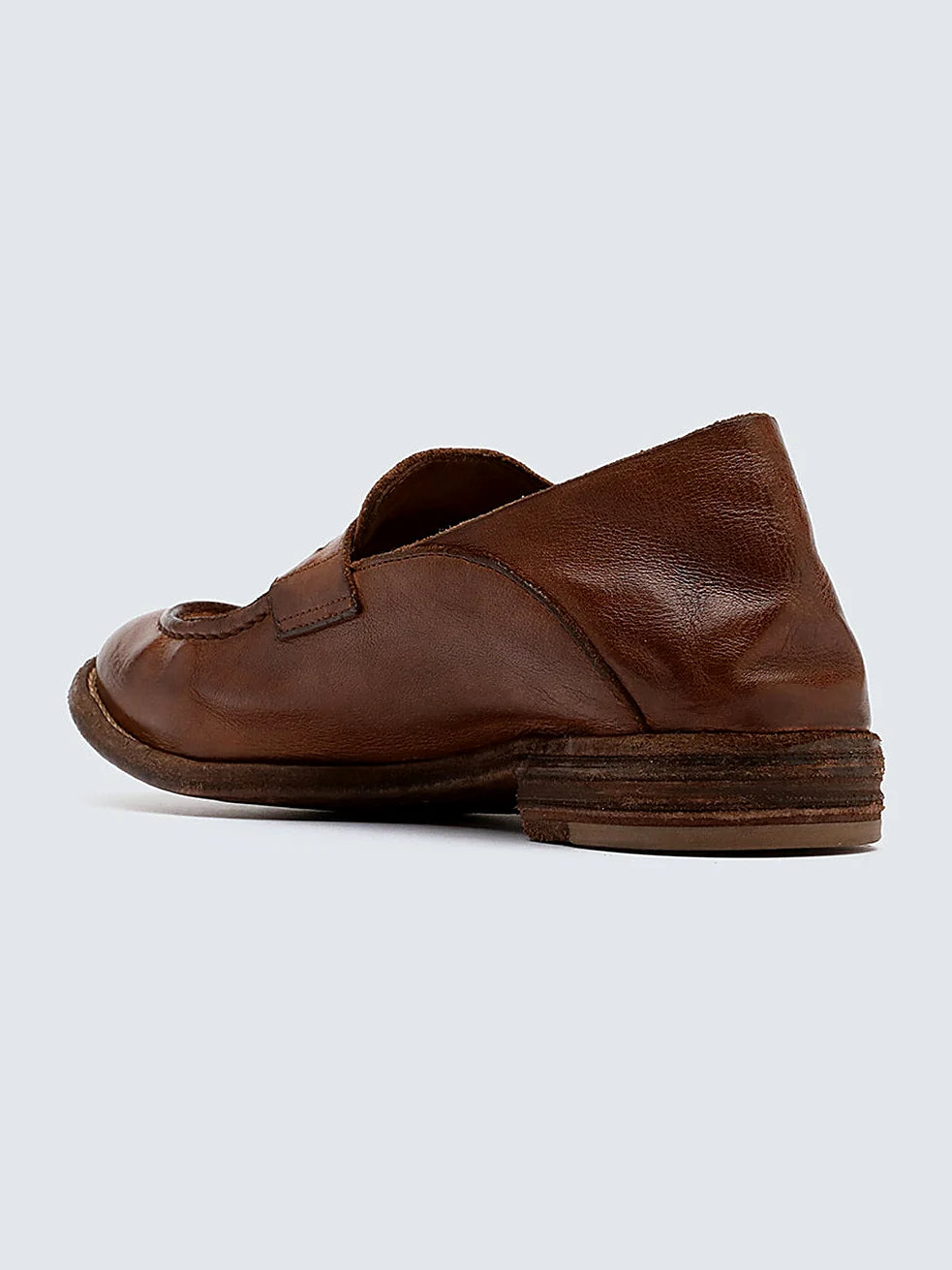 Brown leather loafers viewed from above showing the opening
