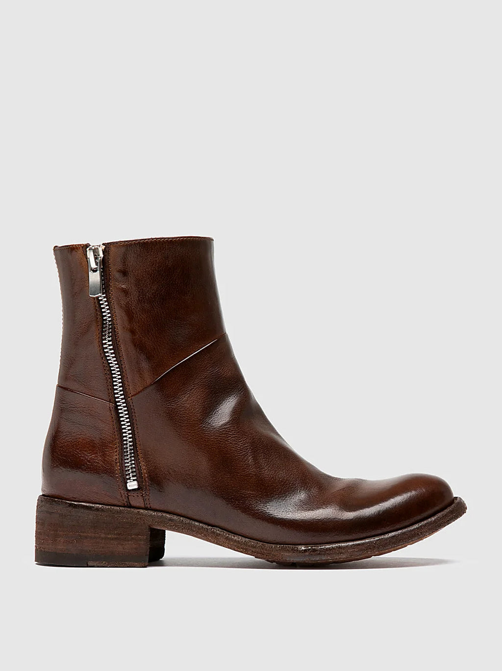 Brown twin zips seen at an angle showing the toe