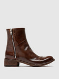 Brown twin zips seen at an angle showing the toe