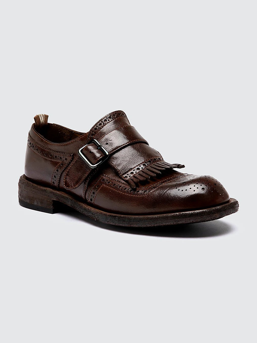 Brown and buckle close view of the heel and sole edge