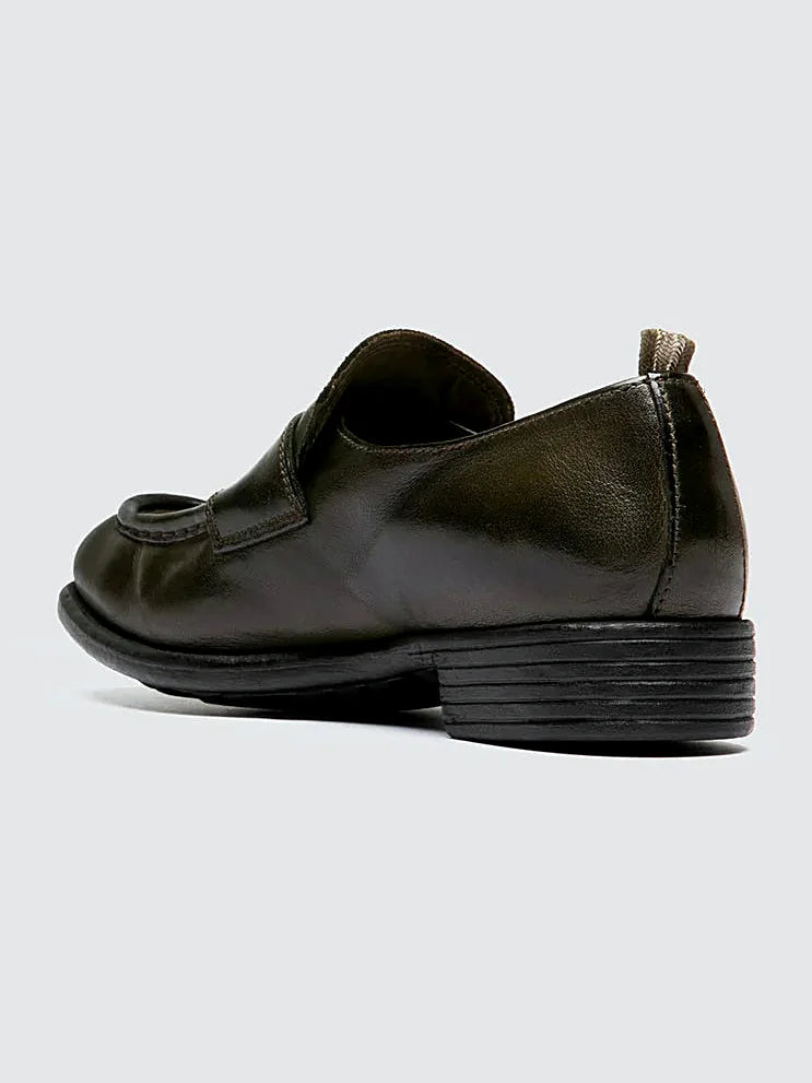 Green leather loafers close view of the fastening