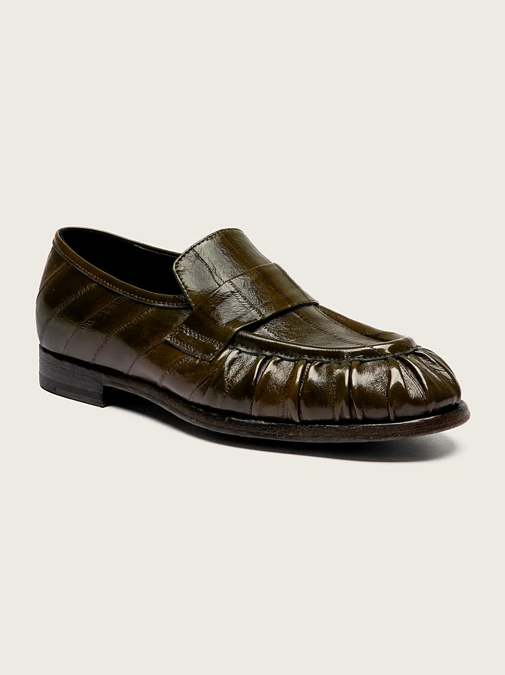 Green engraved sole pair arranged together on a neutral ground