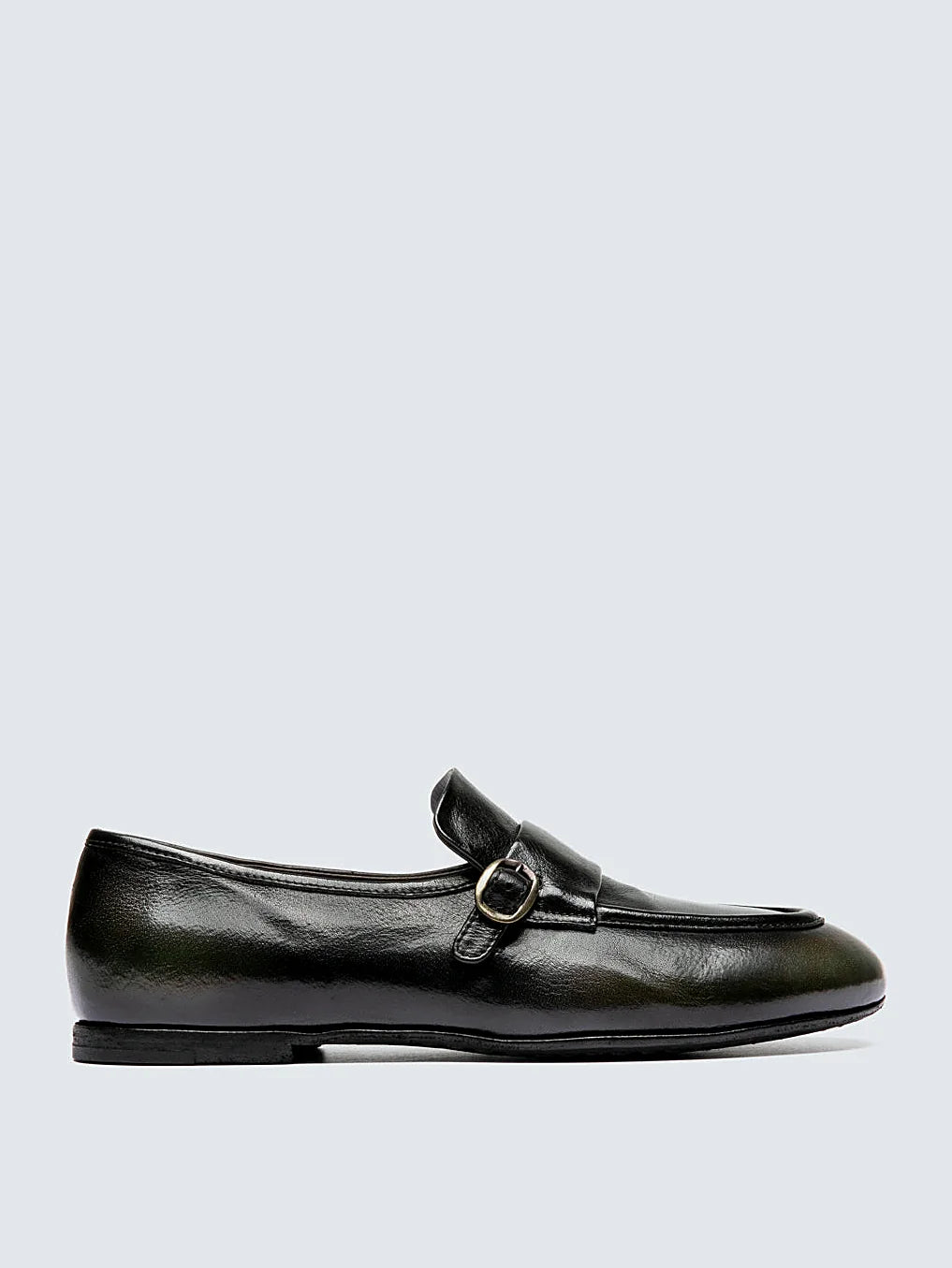 Green leather loafers viewed from above showing the opening