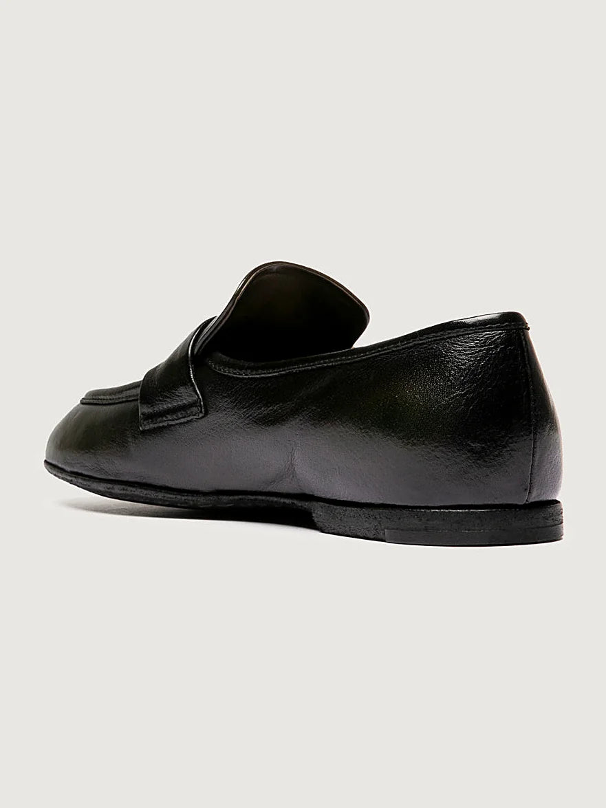 Green leather loafers front view showing the shape of the toe