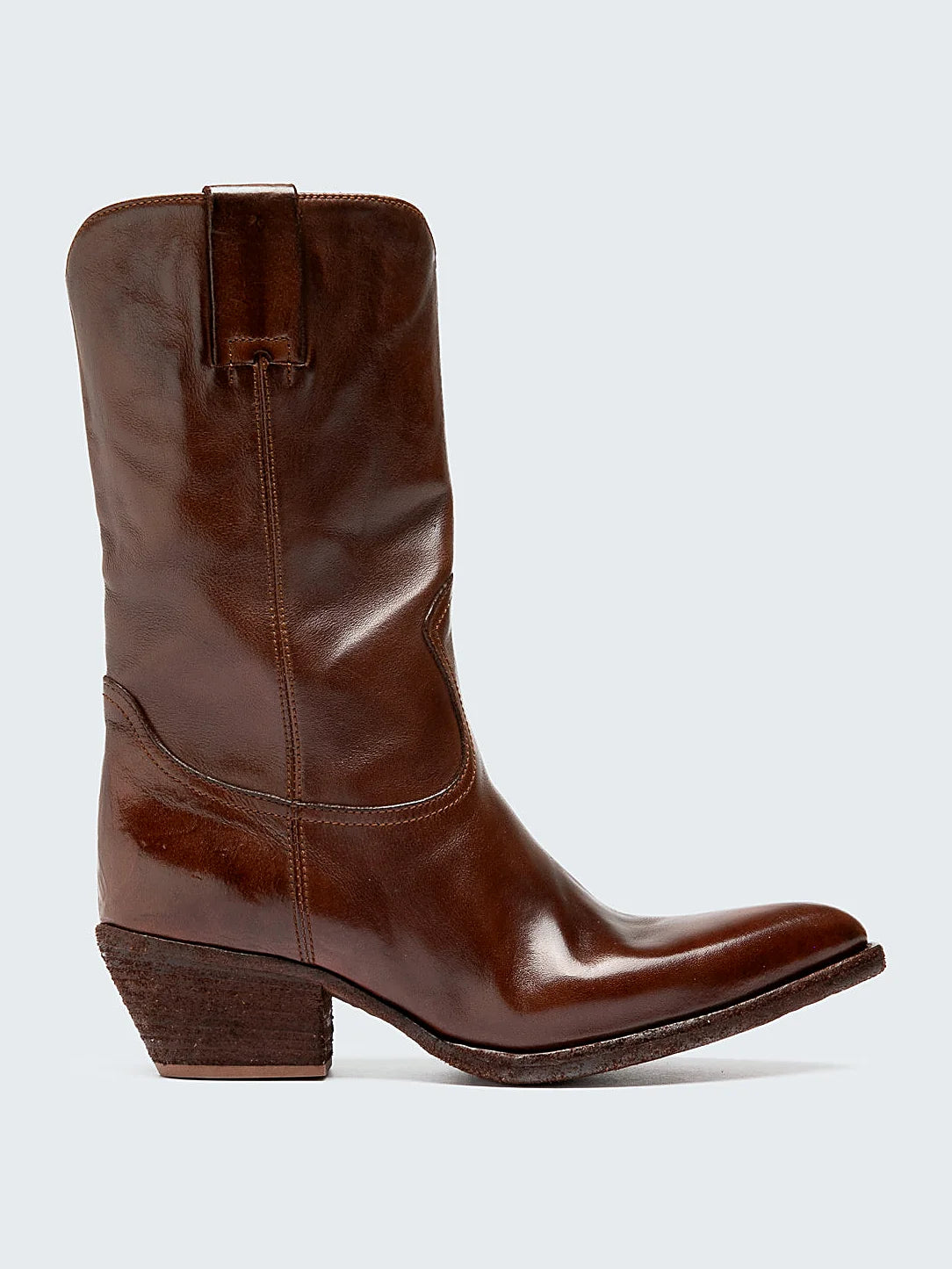 Brown slanted heel pair arranged together on a neutral ground
