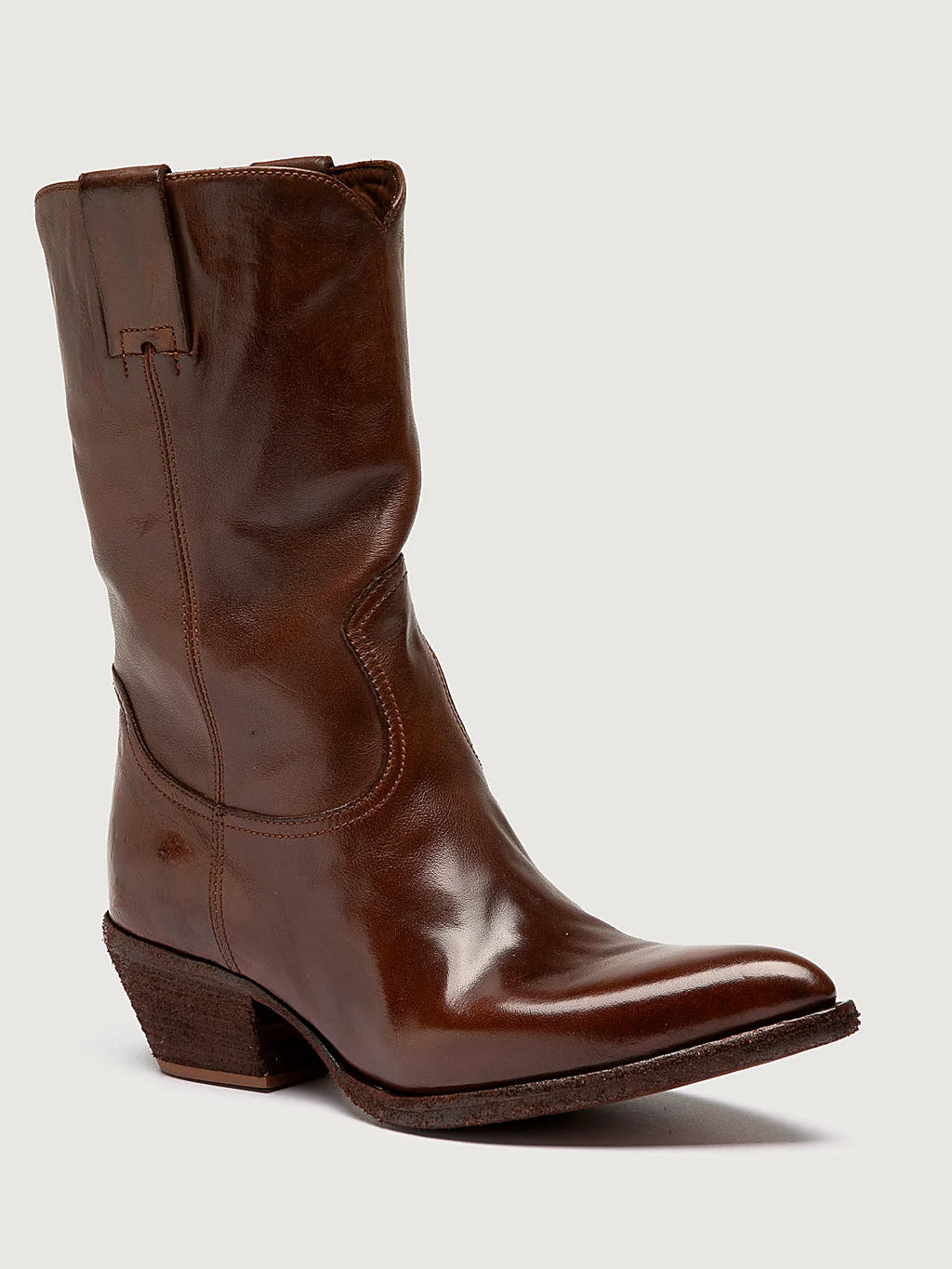 Brown slanted heel shown from the side on a plain background