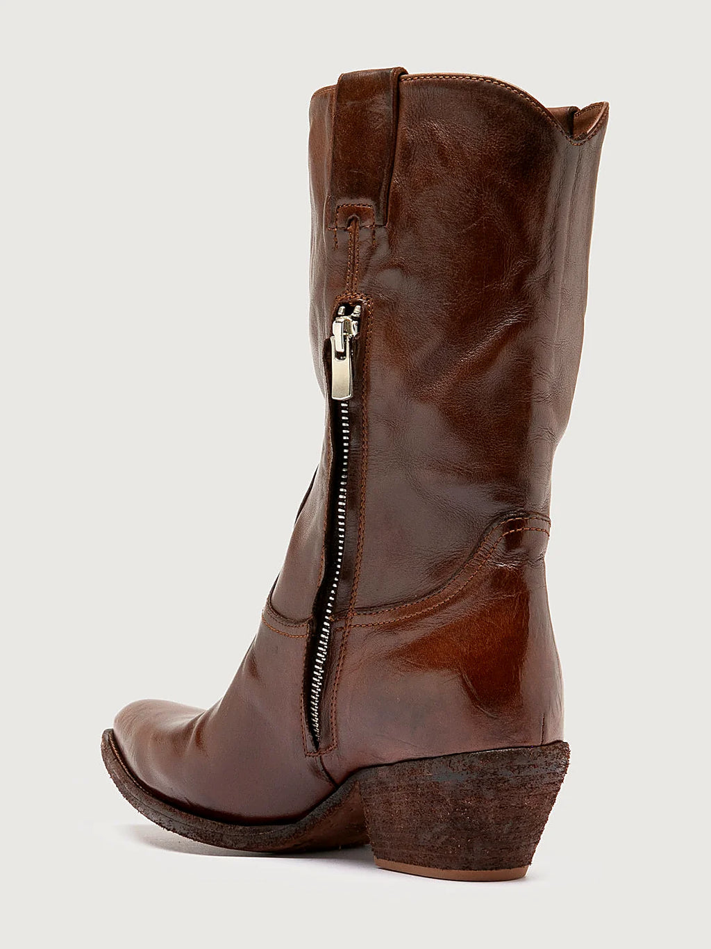 Brown slanted heel seen at an angle showing the toe
