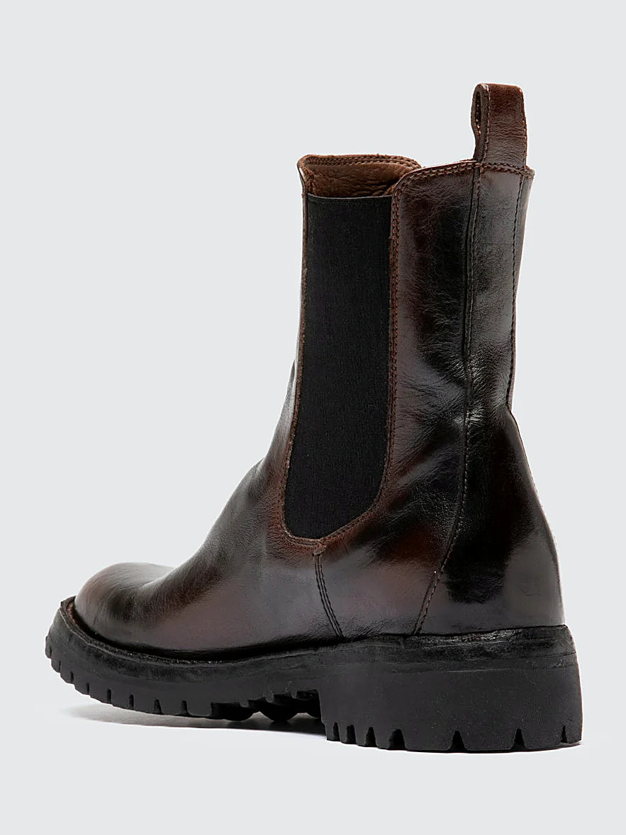 Brown chelsea boots close view of the fastening