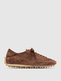 Brown suede sneakers close view of the heel and sole edge