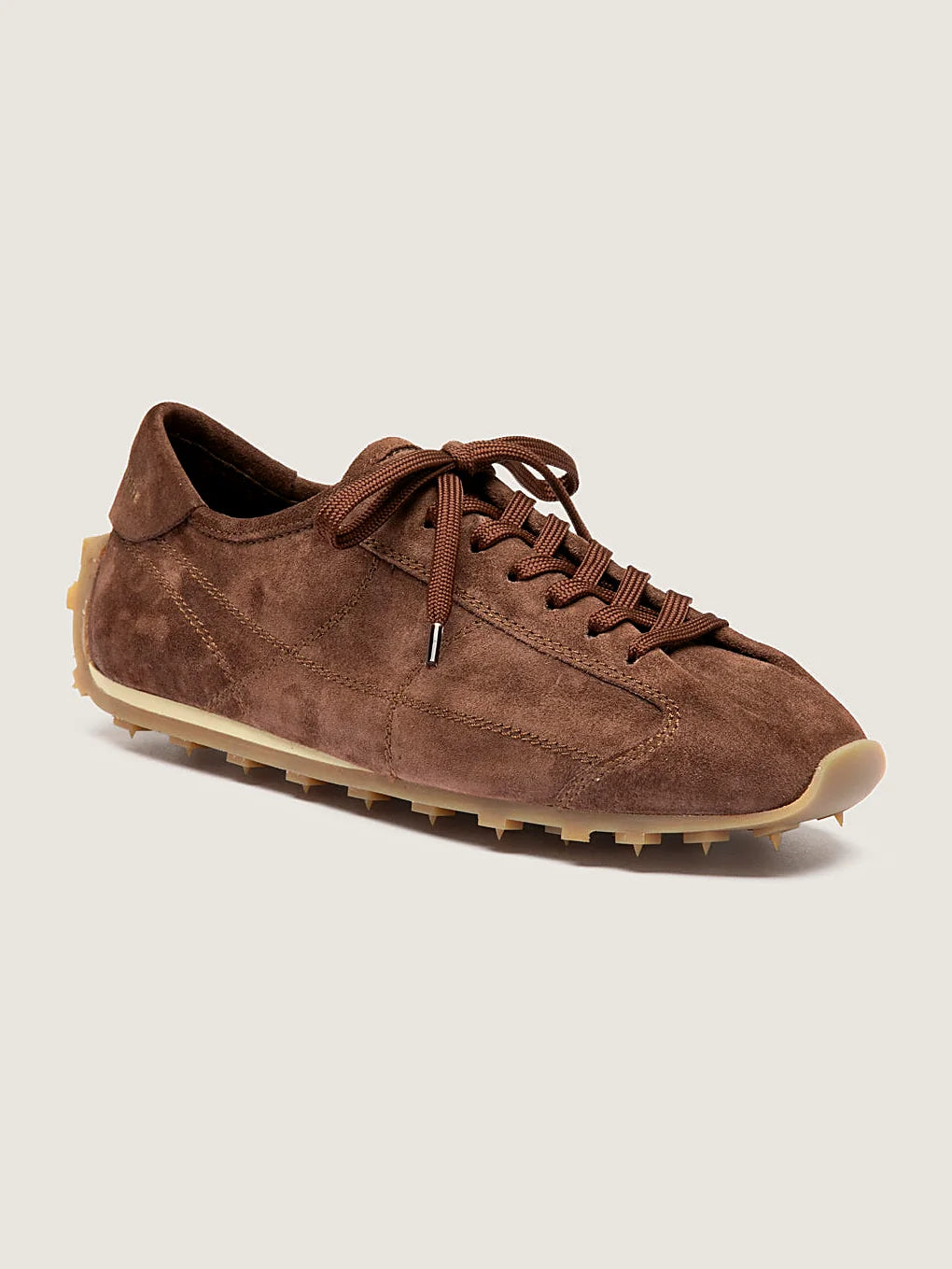 Brown suede sneakers front view showing the shape of the toe