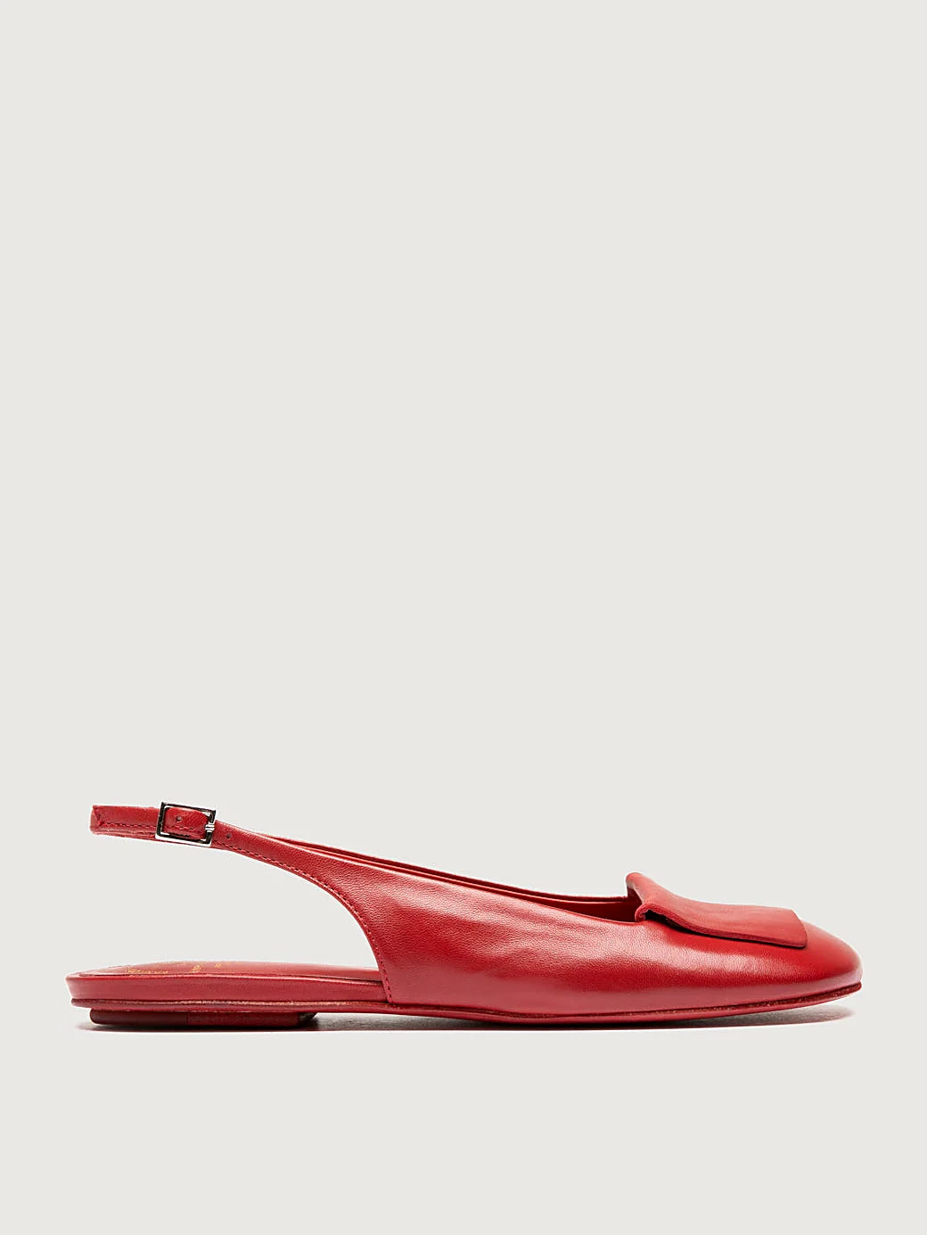 Red adjustable strap pair arranged together on a neutral ground
