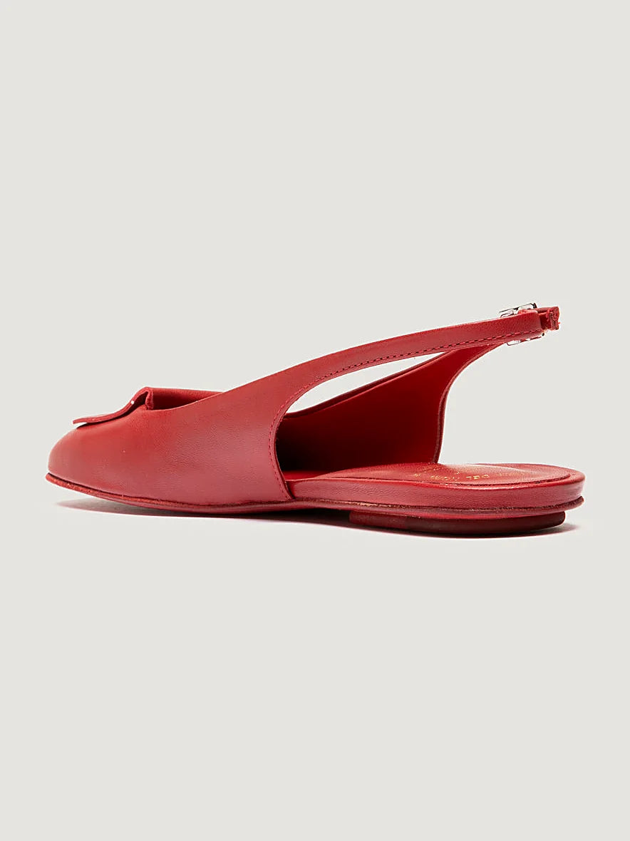 Red adjustable strap shown from the side on a plain background