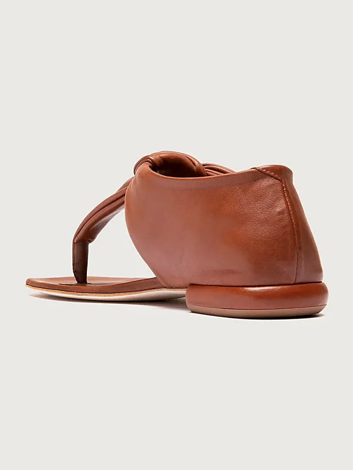 Brown thong sandals close view of the fastening