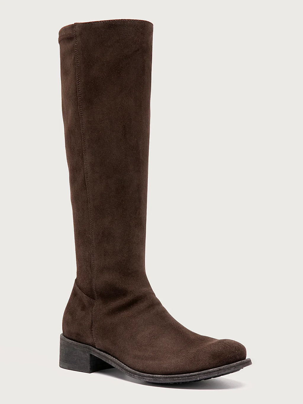 Brown brown suede pair arranged together on a neutral ground