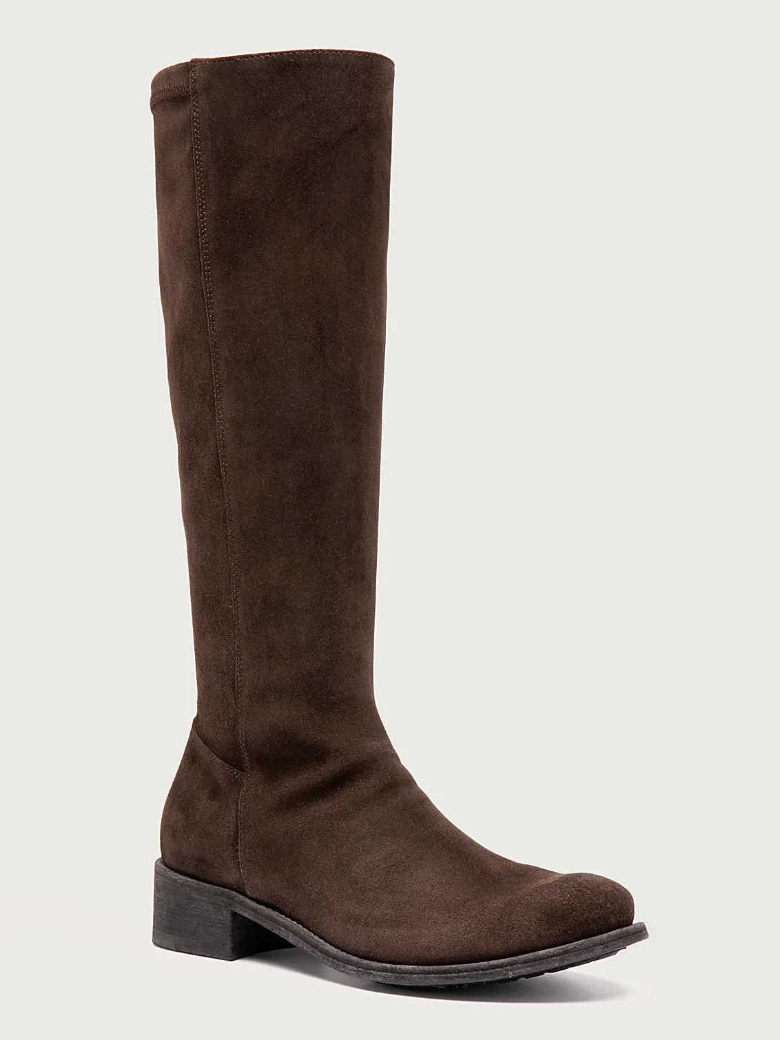 Brown brown suede pair arranged together on a neutral ground