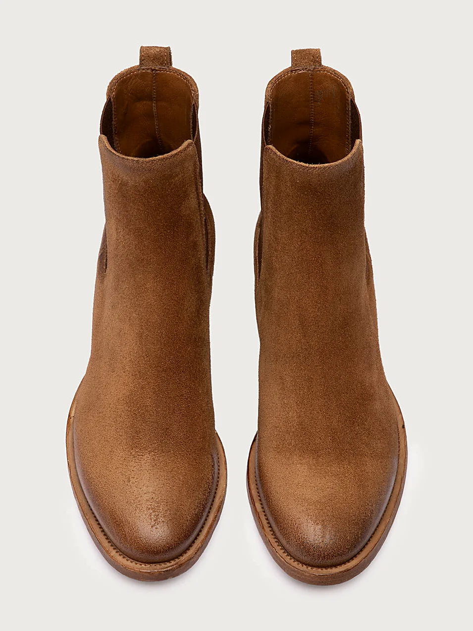 Brown chelsea boots detail of the stitching and upper